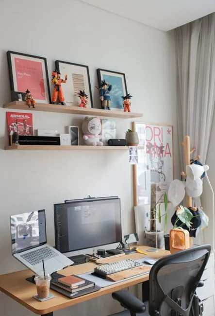 A sleek office desk setup featuring Apple devices: iMac, MacBook, and iPad.